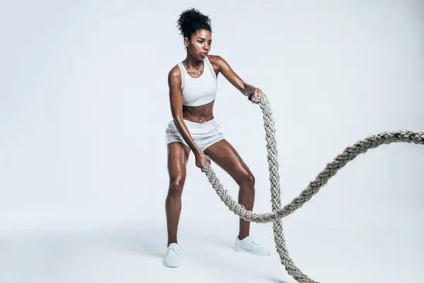 Athlete working out with battle ropes