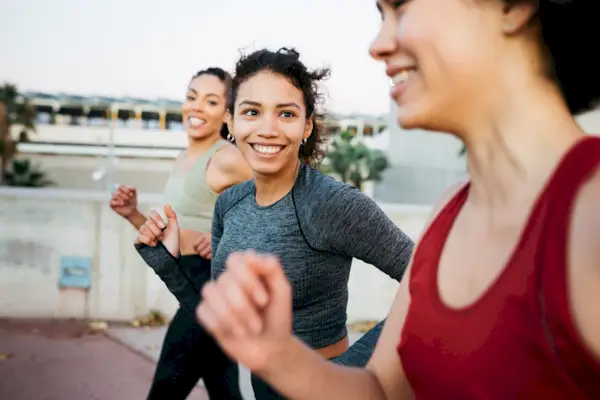 Some Fitness Enthusiasts Stretching Before Going For Run Together