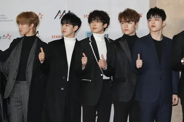 members of boy band Seventeen with curly hair