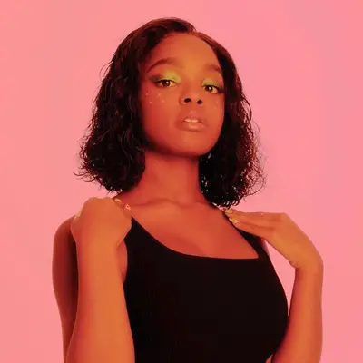 Marsai Martin wears a curly long bob hairstyle