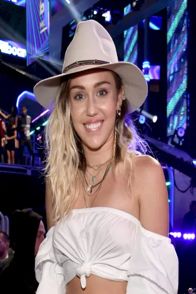 Miley Cyrus deep side part 00s hairstyle