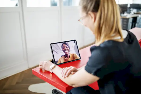 Female executives having video call in office