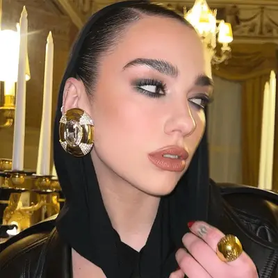 Dua Lipa wearing a slept-in smokey ey