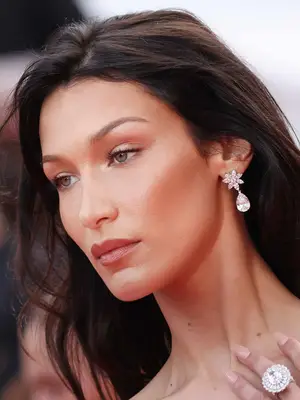 Bella Hadid with a radiant makeup look and thin