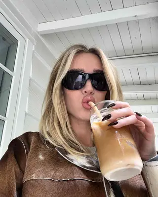 Alex Cooper drinking coffee