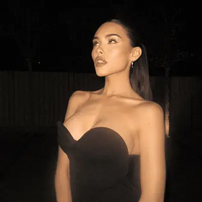 Madison Beer in a black top
