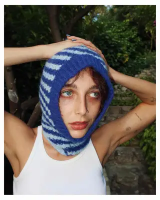 Emma Chmaberlain wearing a knit hood