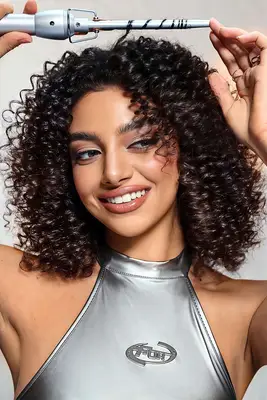 A model using a SHEGLAM hair tool.