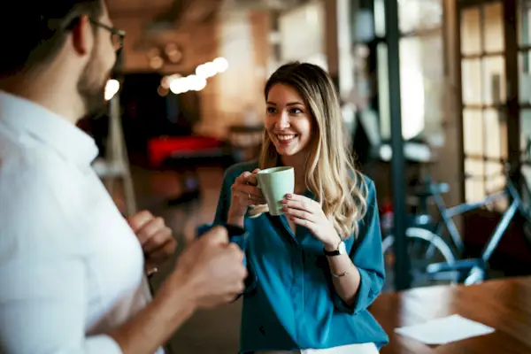 Colleagues drinking coffee in the office