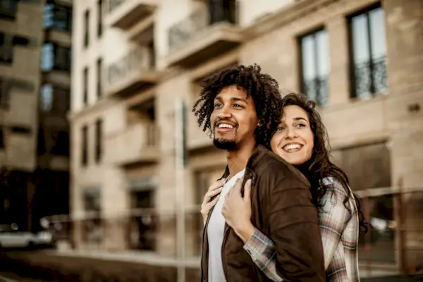 two hands reaching for each other