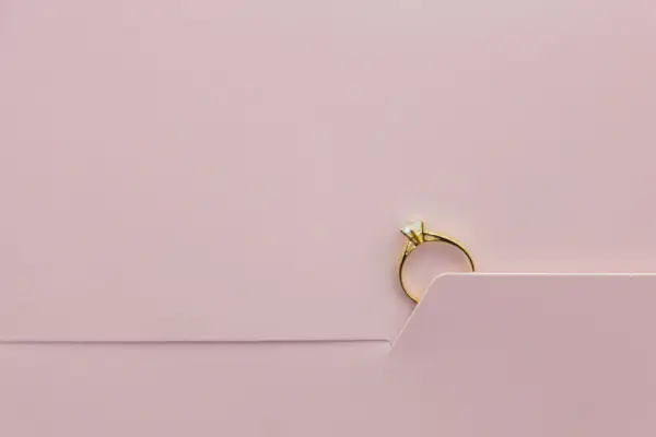 Close Up Of Engagement Ring On Greeting Card