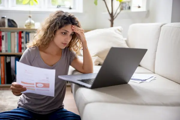 Woman looking very concerned about her home finances