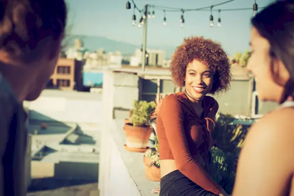 Friends hanging out on urban rooftop