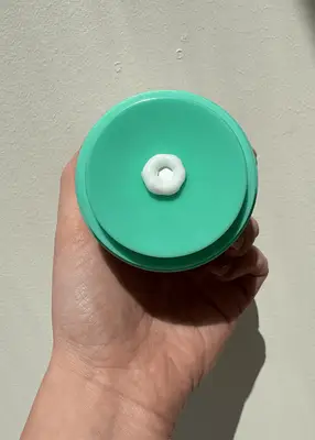 close up of drunk elephant protini polypeptide cream texture in pump tub