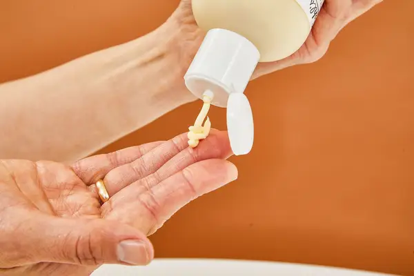 A person squeezing Kiehl