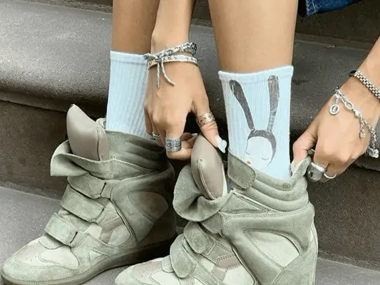 Alessandra Ambrosio wearing sneaker wedges in 2012