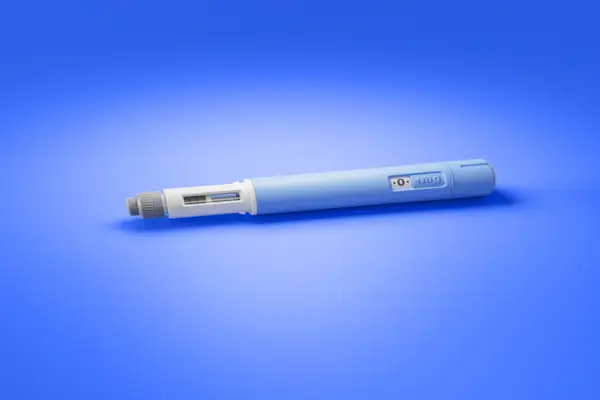 image of weight loss drug with blue background