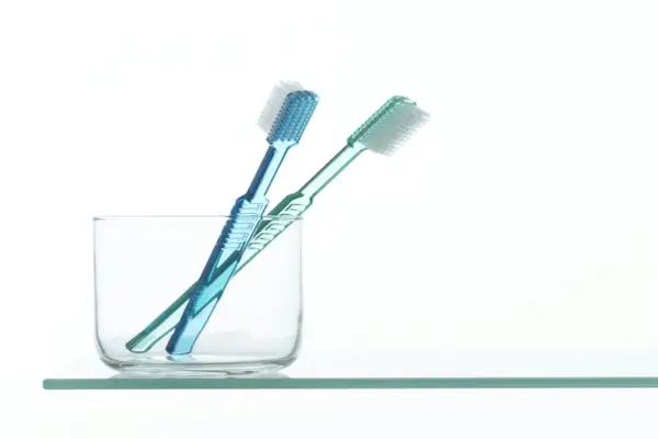 Toothbrushes in clear container