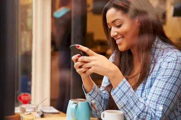 Woman texting on smartphone