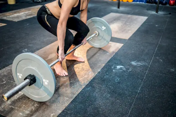 Gym fitness workout: Woman weightlifting