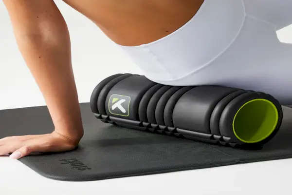 warming up at the gym before starting her workout