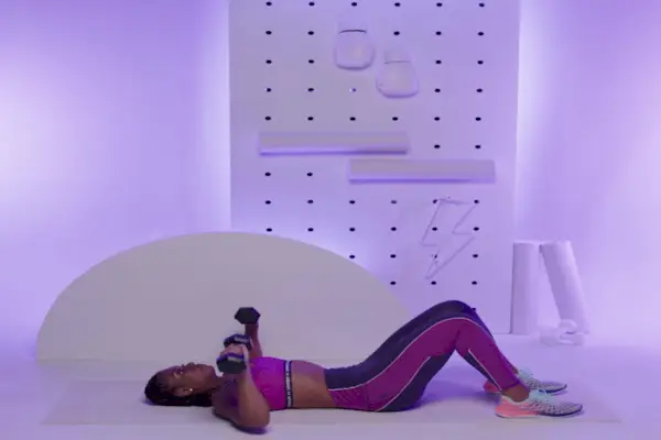 Female athlete skipping with jumping rope in gym