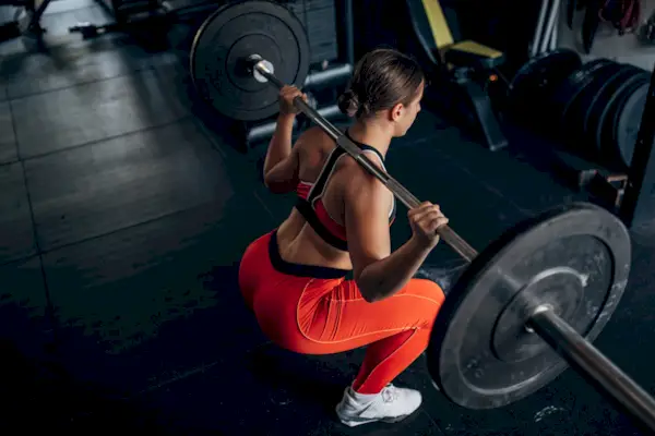 Women Doing Barbell Back Squat