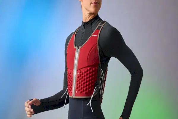 Midsection of a woman jogging by a tranquil body of water