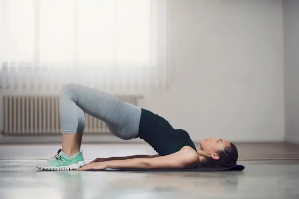 Street Workout: Young African American Doing Bridge On Yoga Mat