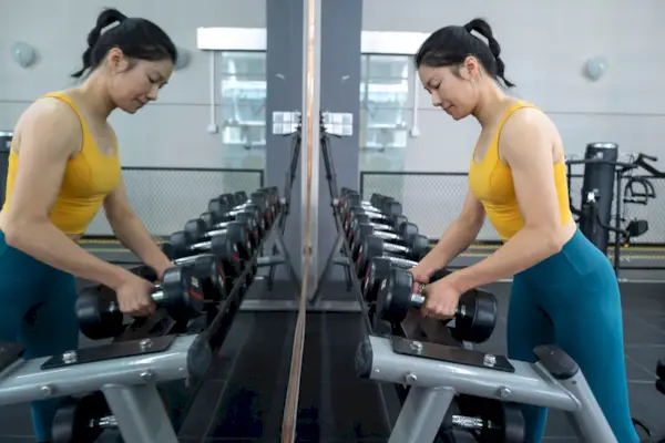 Action gesture before preparing to lift a dumbbell