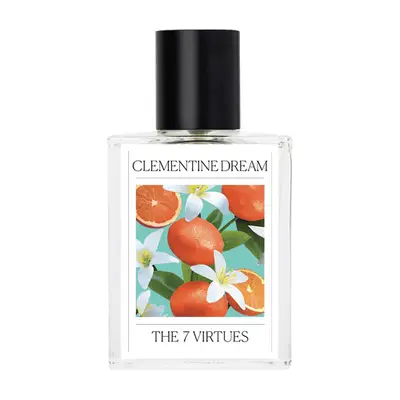 White fragrance bottle with picture of oranges on it 