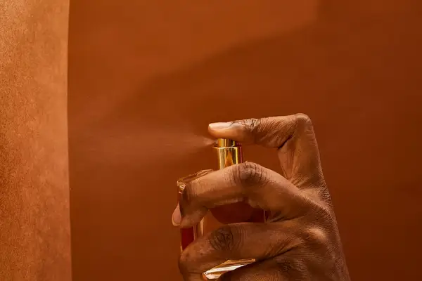 A person sprays Maison Francis Kurkdjian Baccarat Rouge 540 Eau de Parfum