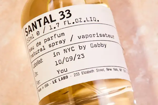 The label on a bottle of Le Labo Santal 33 Eau de Parfum