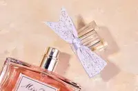 A bottle of DIOR Miss Dior Eau de Parfum with the cap off