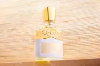 A bottle of Creed Aventus for Her