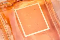 A closeup of the label on a bottle of Chanel Coco Mademoiselle perfume