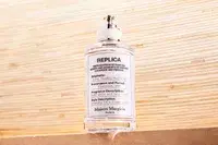 A bottle of Maison Margiela Replica Lazy Sunday Morning Perfume