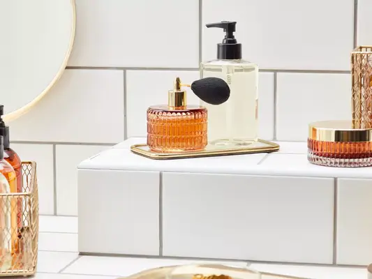 Image of a vanity with perfume and other bottles