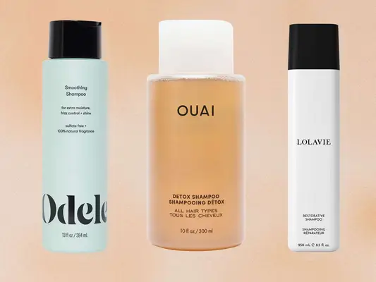 Three sulfate-free shampoos on a tan background