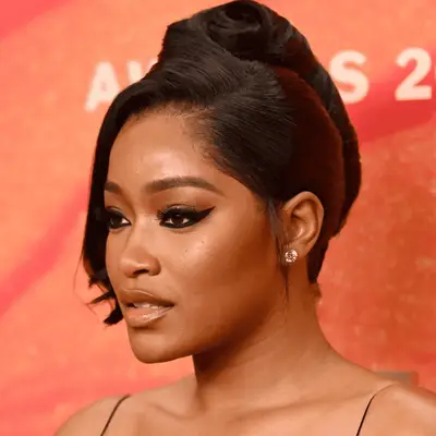 keke palmer wearing a french twist updo