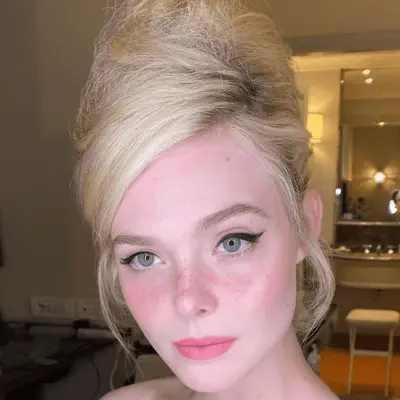 elle fanning wearing a beehive