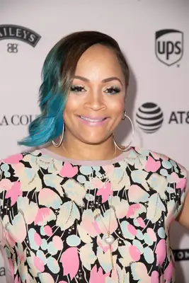 Simone Smith with an asymmetrical haircut with blue-dyed tips