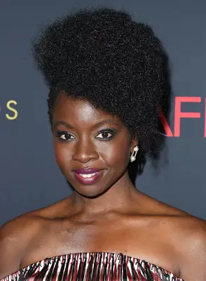 Danai Gurira with a textured, asymmetrical afro hairstyle