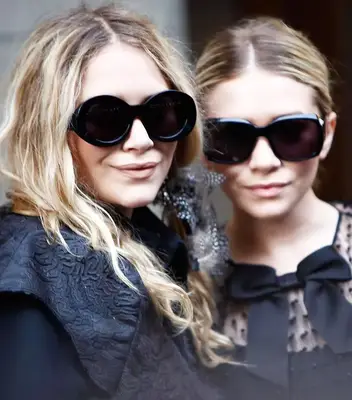 Mary-Kate and Ashley wearing big, black sunglasses