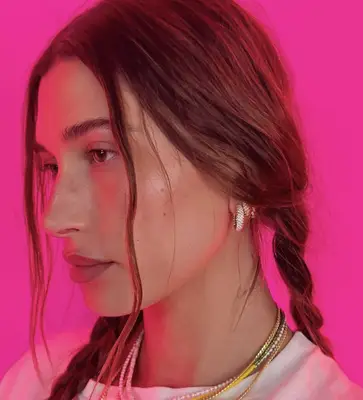 Hailey Bieber wears pigtail braids for a lived-in wavy texture