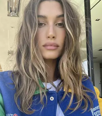 Hailey Bieber with sun kissed highlights