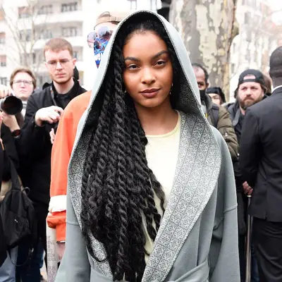 Sharon Alexie wears waist-length Havana twists and hooded Loewe robe