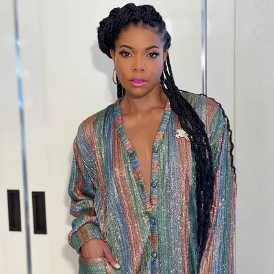 Gabrielle Union wears waist-length box braids half-up in halo crown