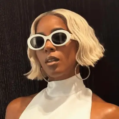 Kendall Jenner attends the Bottega Veneta fashion show in a long grown out blonde bob that