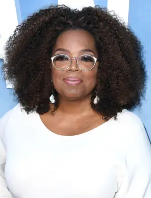 Oprah Winfrey with a Center Part afro With Volume